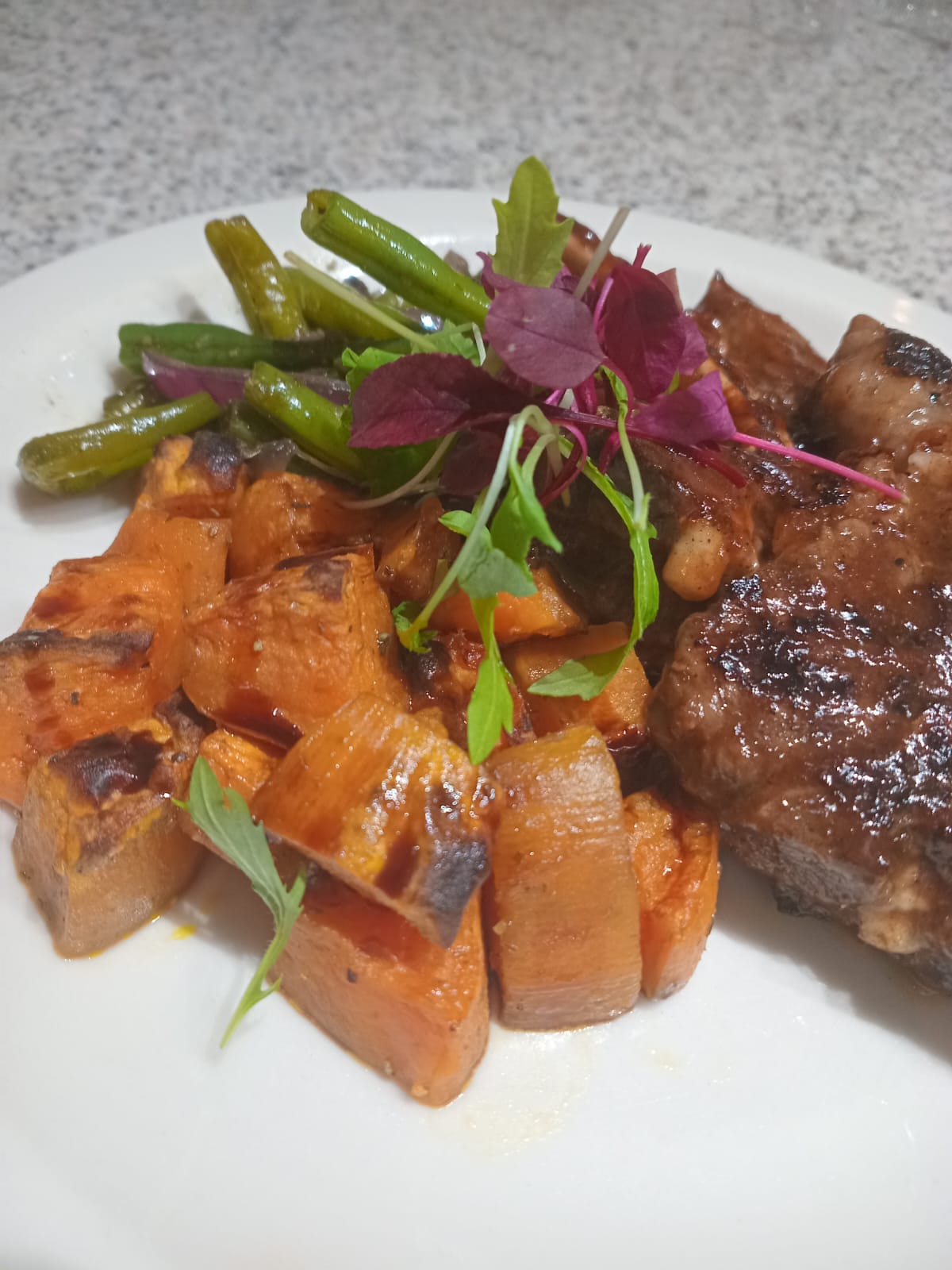Glazed pork ribs with roasted sweet potato and green beans